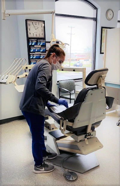 the Stein Dental Care team preparing a dental chair for the next patient