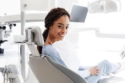 woman smiling in the dental chair during her visit to Stein Dental Care