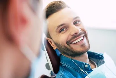 man discussing gum disease treatment with Dr. Stein at Stein Dental Care
