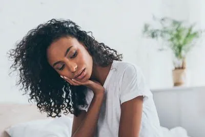 woman suffering from tooth pain