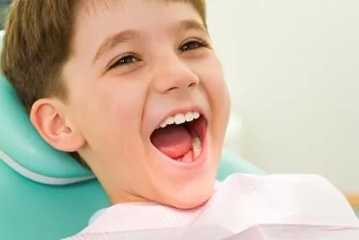 young child smiling during his dental appointment at Stein Dental Care