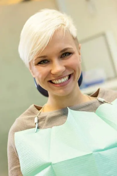 woman smiling during her dental cleaning at Stein Dental Care